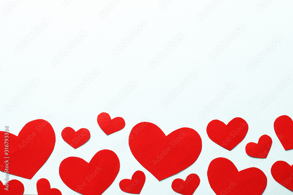 Decorative hearts on a blue background. Valentine's day decor concept. February 14