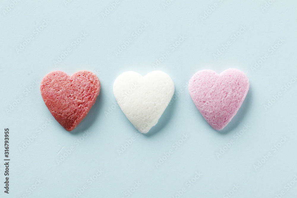 Decorative hearts on a blue background. Valentine's day decor concept. February 14 Decorative hearts on a blue background. Valentine's day decor concept. February 14