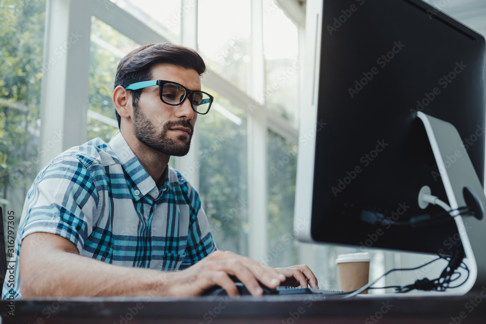 Freelancer working from home and using computer. Freelancer working from home and using computer.