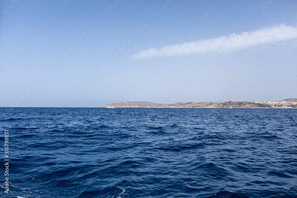 Fantastic views of rocky coast on a sunny day with blue sky. Picturesque and gorgeous scene. Malta. Europe. Mediterranean sea. Beauty world.