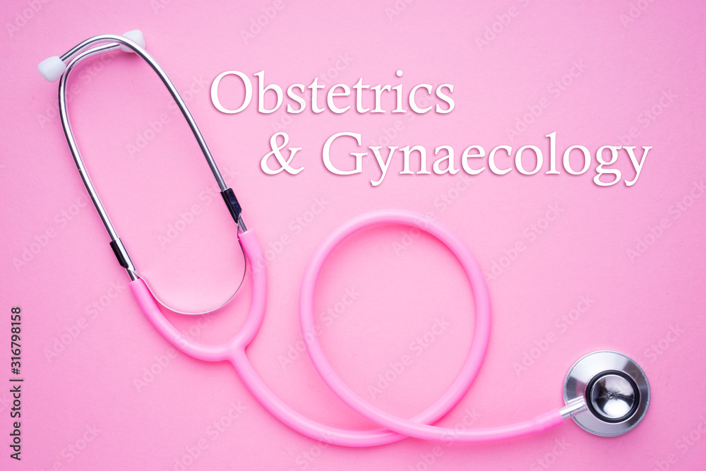 Women in healthcare concept. A pink strethoscope on a pink background ...