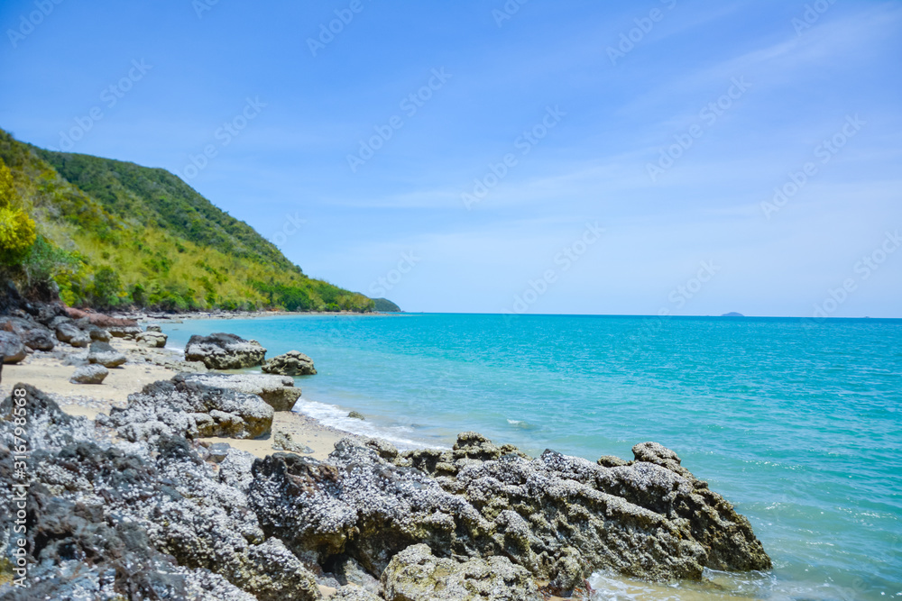 The beach is full of rocks,beach full of rocks in Montenegro with beautiful view to sea,Beautiful scenery on the beach at low tide seen rocks on the mainland full of charm.