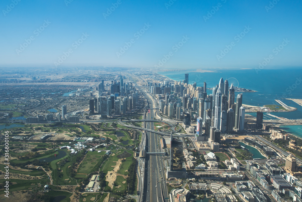Aerial view of Dubai Marina district and sheikh Zayed Road. Dubai, United Arab Emirates.
