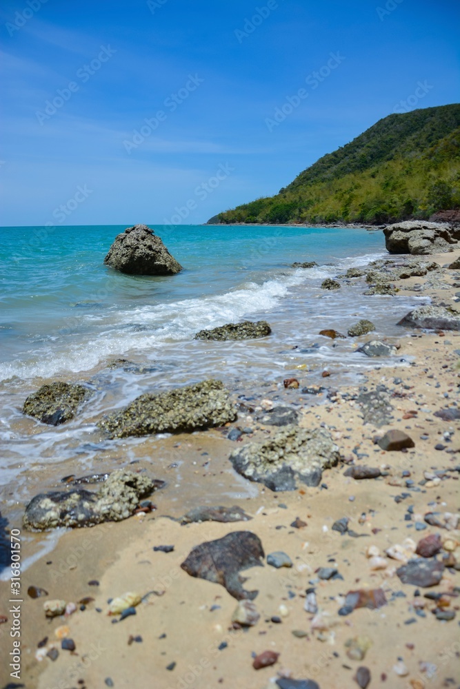 The beach is full of rocks,beach full of rocks in Montenegro with beautiful view to sea,Beautiful scenery on the beach at low tide seen rocks on the mainland full of charm.