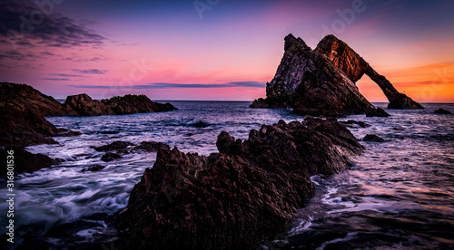 Sunrise at Bow Fiddle Rock - Scotland © greg