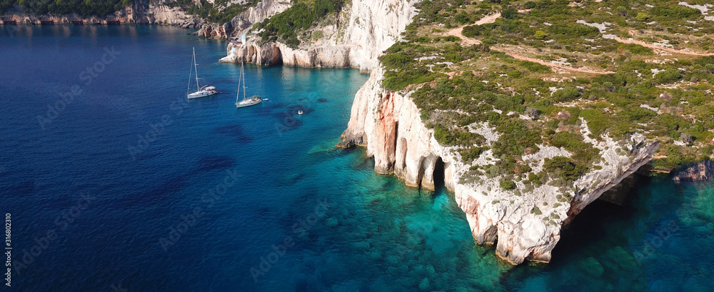 Aerial drone ultra wide photo of famous blue caves in North part of Zaktynthos island, Ionian, Greece