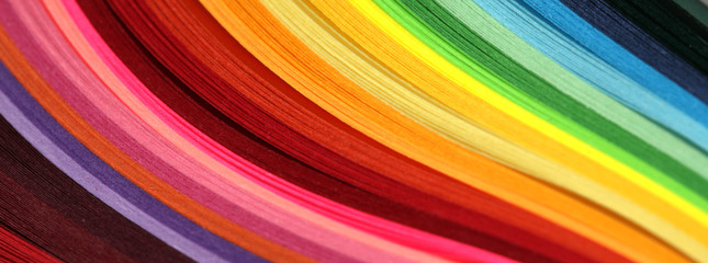 Horizontal Abstract vibrant color wave rainbow strip paper background.