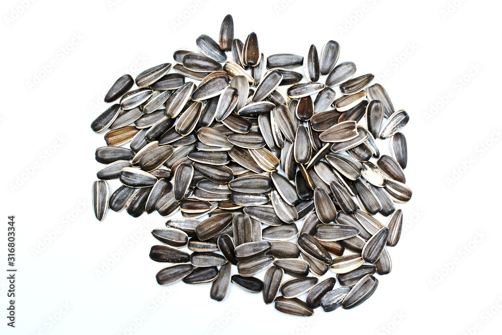 Sunflower seeds isolated on white background, top view