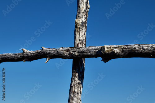 Wooden cross trimming the sky