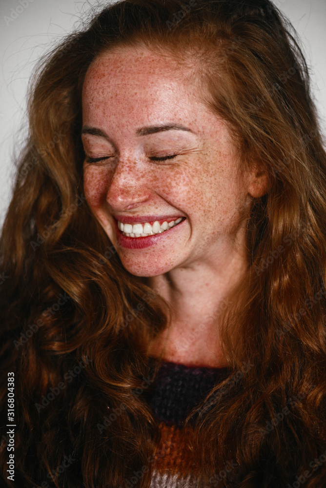 Portrait of cheerful freckled girl , close up Portrait of cheerful freckled girl , close up