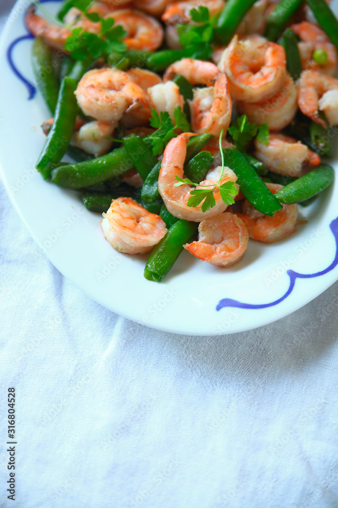 Shrimp and snap pea dinner vertical Shrimp and snap pea dinner vertical