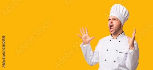 Emotional Chef Man Shouting Standing Over Yellow Studio Background, Panorama