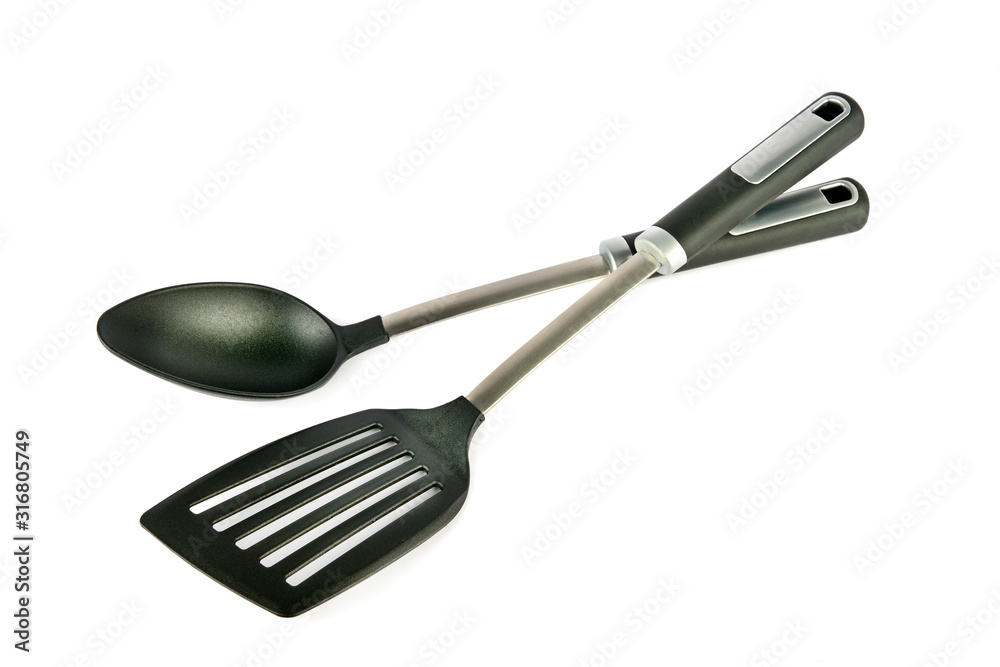 Kitchen spoon and spatula on isolated white background. Kitchen spoon and spatula on isolated white background.