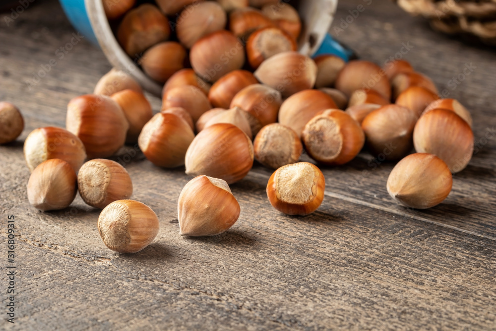 Whole hazelnuts on a table with copy space