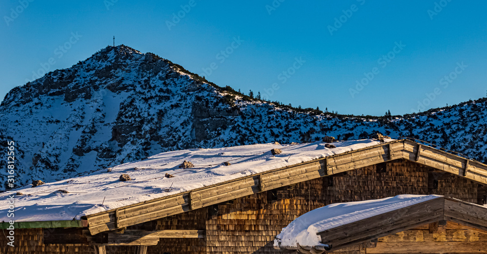 Fototapeta premium Beautiful winter wonderland with a wooden house at the famous Predigtstuhl, Bad Reichenhall, Bavaria, Germany