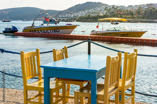 View of restaurant or cafe on beach in Gumbet. Aegean sea, Bodrum, Turkey