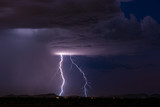 Lightning bolt strike from a thunderstorm cloud