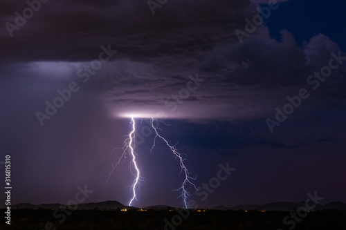 Lightning bolt strike from a thunderstorm cloud