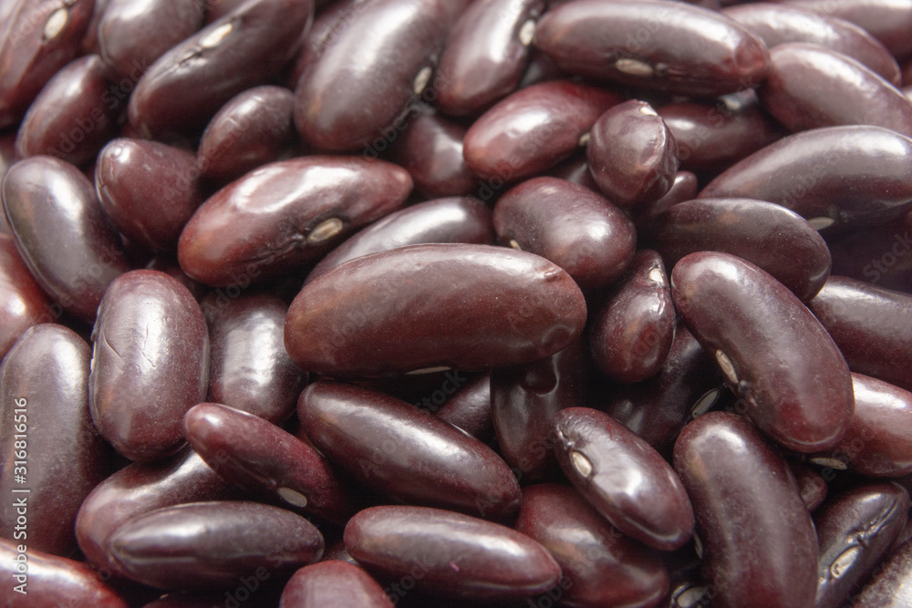 Close up of raw kidney beans / Red beans background / Horizontal view Close up of raw kidney beans / Red beans background / Horizontal view
