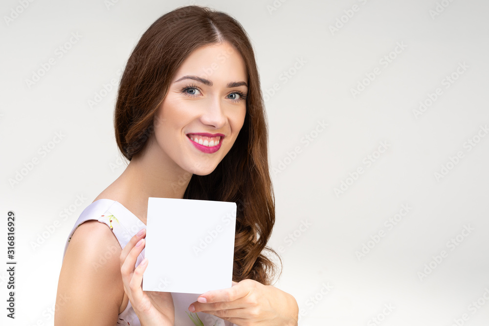 brown-haired woman looks at an imaginary product brown-haired woman looks at an imaginary product