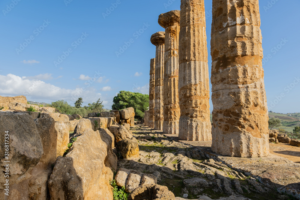 Ruined Temple of Heracles columns in famous ancient Valley of Temples in Agrigento, Sicily, Italy.