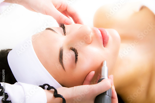 The procedure of laser resurfacing a face close-up. photo