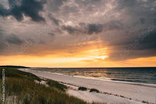 Late summer sunset on the Baltic sea coastline. Landscape of a beach near Ustka  Poland.