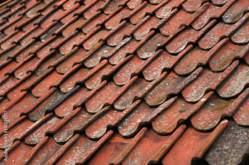 Closeup of old red clay roof tiles, for backgrounds or textures
