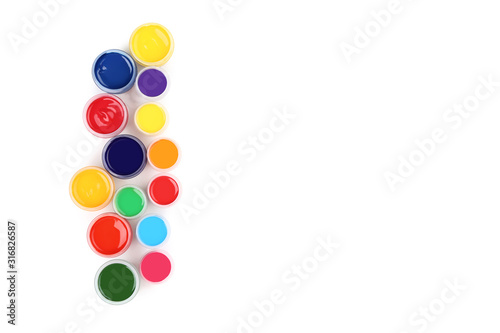 Colorful gouache paints isolated on white background
