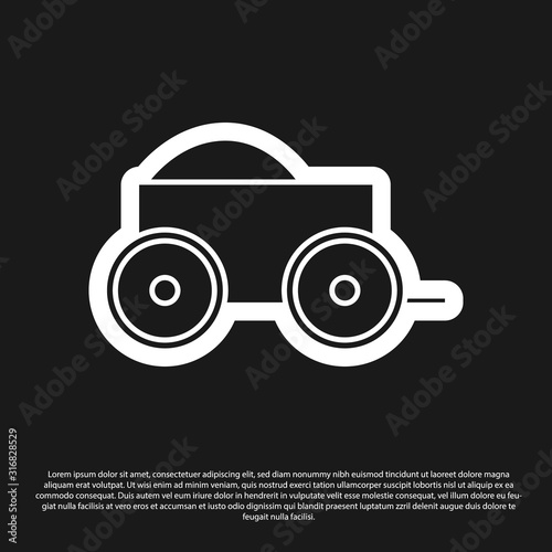 Black Wooden four-wheel cart with hay icon isolated on black background. Vector Illustration