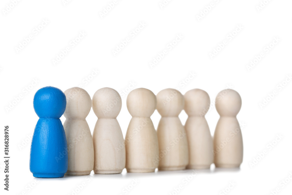 Leader concept. Wooden figures on white background Leader concept. Wooden figures on white background