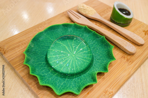 Japanese dessert serving with brown sugar and syrup at restaurant photo