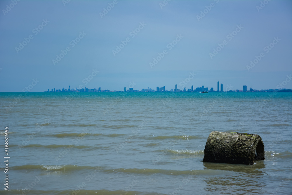 Low tide at noon, sunny at the Thai sea, north of Pattaya.