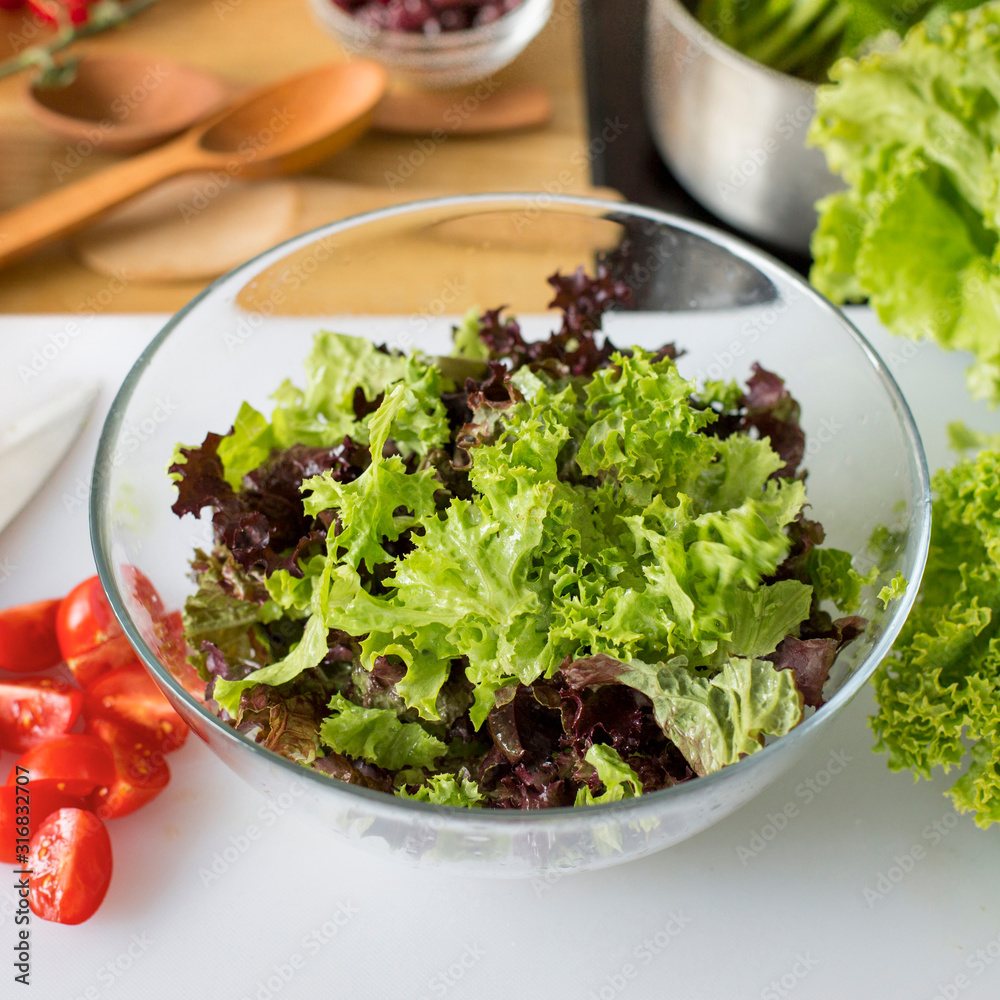 Close up of fresh healthy full of vitamins salad in glass plate Close up of fresh healthy full of vitamins salad in glass plate
