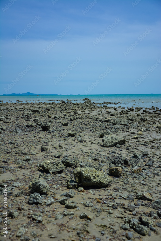Stone courtyard on the public beach,Beautiful seascape with natural stone yard on beach against cloudy sky,Rocky shore at the seacoast with seascape and blue sky, Stone courtyard on the public beach,Beautiful seascape with natural stone yard on beach against cloudy sky,Rocky shore at the seacoast with seascape and blue sky,