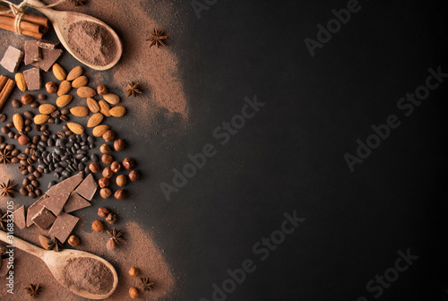 Chocolate with hazelnuts, almonds, cocoa on a dark background. Dark chocolate. Chocolate bar. Close-up. Chocolate background. Culinary background. Copy space.