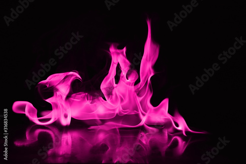 Canvas Print Beautiful fire pink flames on a black background.