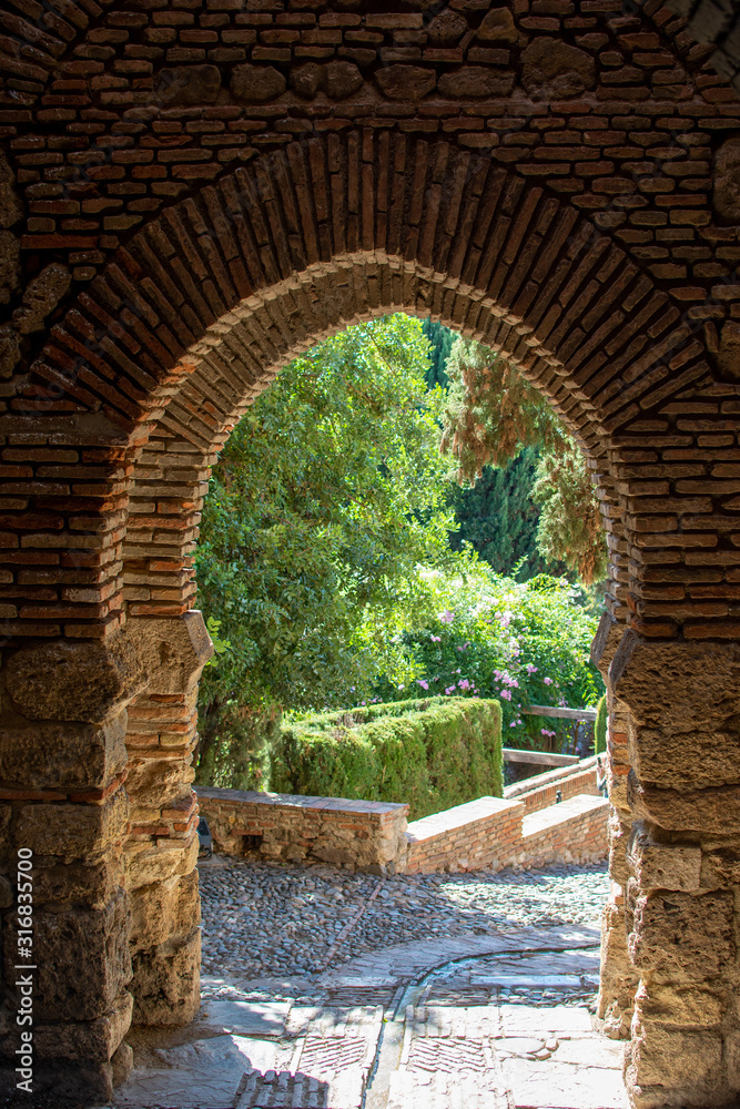 Stone archway with a view to garden