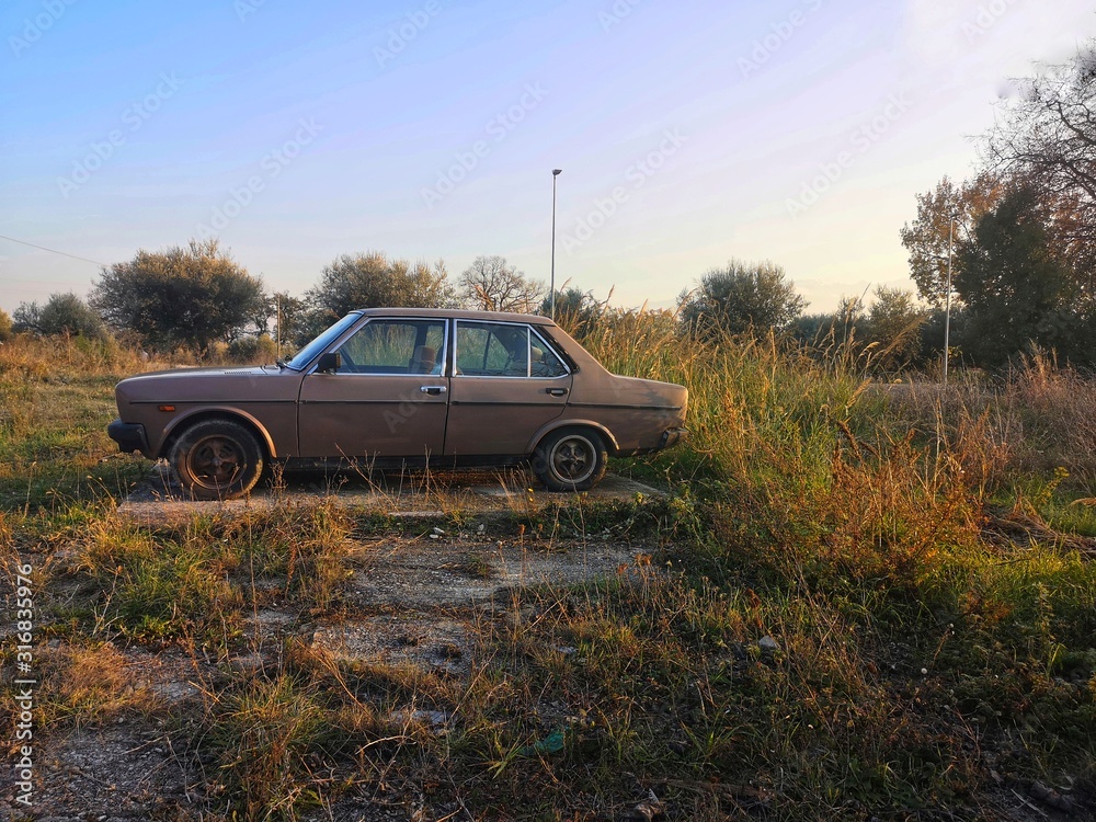 old car abandoned in the countryside old car abandoned in the countryside