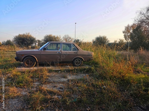 old car abandoned in the countryside