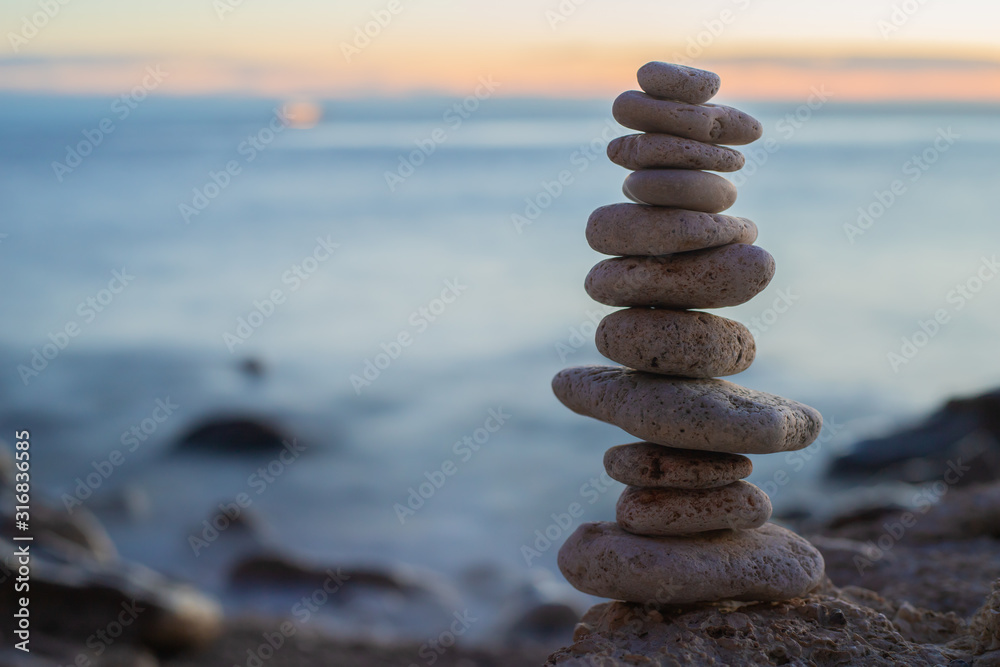 Zen concept. Sunset. The object of the stones on the beach at sunset.  Relax & Meditation. Zen stones. Blue hour