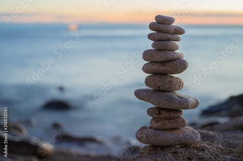 Zen concept. Sunset. The object of the stones on the beach at sunset.  Relax   Meditation. Zen stones. Blue hour