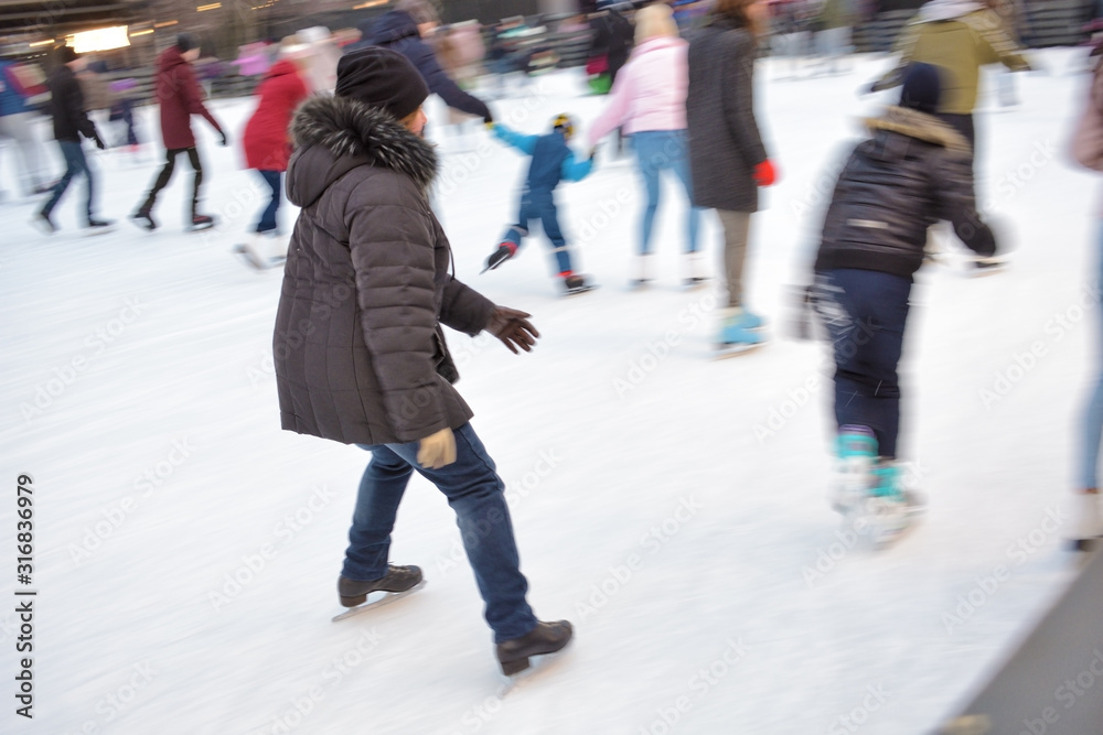 Skating on the ice rink.