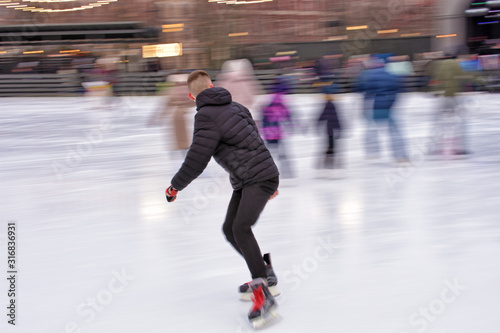 Skating on the ice rink.