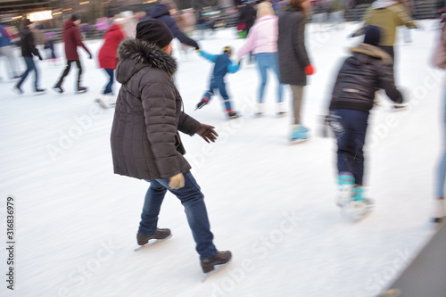 Skating on the ice rink.