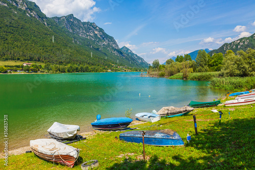 Lake Idro landscape, Boats on the foreground for leisure activities and recreational pursuit.