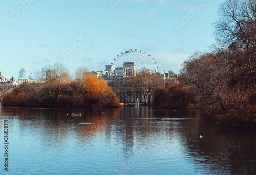 Beautiful St. James's park view in autumn with the London Eye in the background. Central London.
