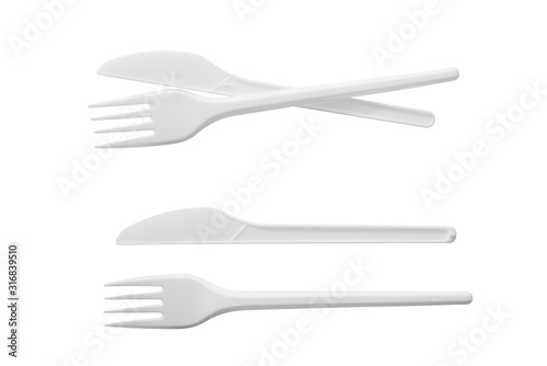 Plastic knife and fork isolated on white background photo