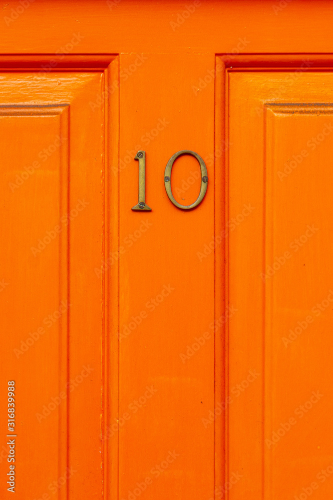 Fototapeta premium Bright and cheerful house number 10