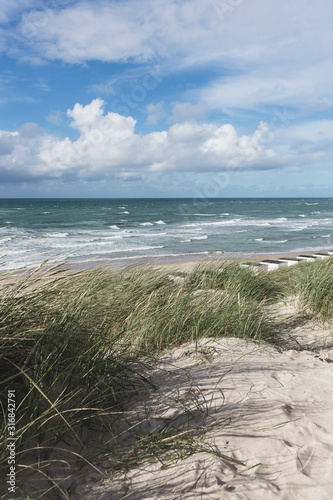 Sky  waves and sand in the summer